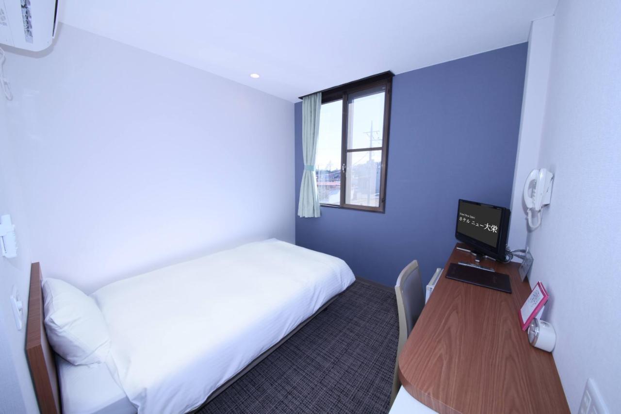 Business Hotel New Daiei آسْكَغَ المظهر الخارجي الصورة